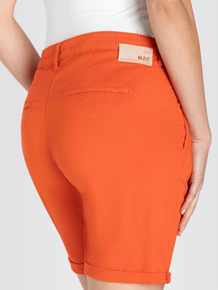 Chino Shorts by Mac Jeans in a light brick red colour, elastic and soft with a turned up look izzi-of-baslow